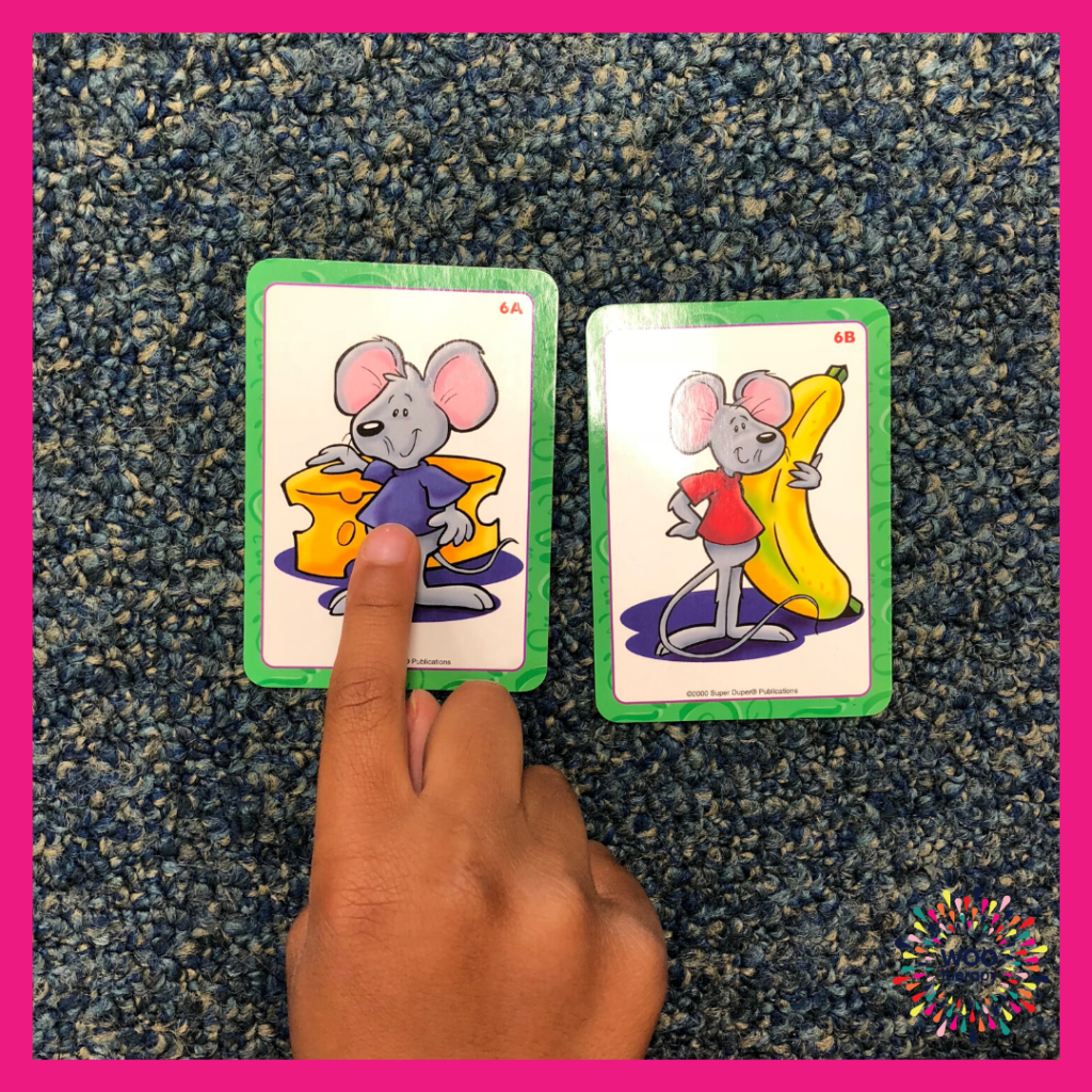 Child using a pointer finger to show the differences between two images.