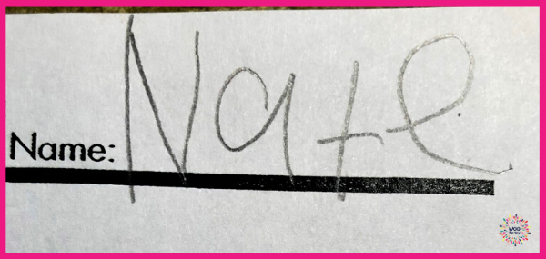 A student's name written largely due to limited visual boundaries.