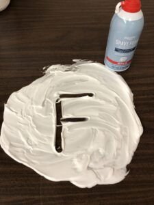 Draw letters in shaving cream