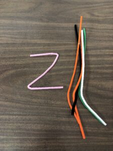 Bend letters out of pipe cleaners