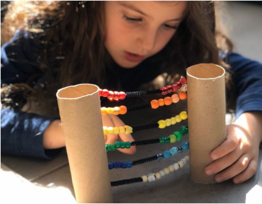 Toilet paper rolls, pipe cleaners, and beads for an DIY abacus.