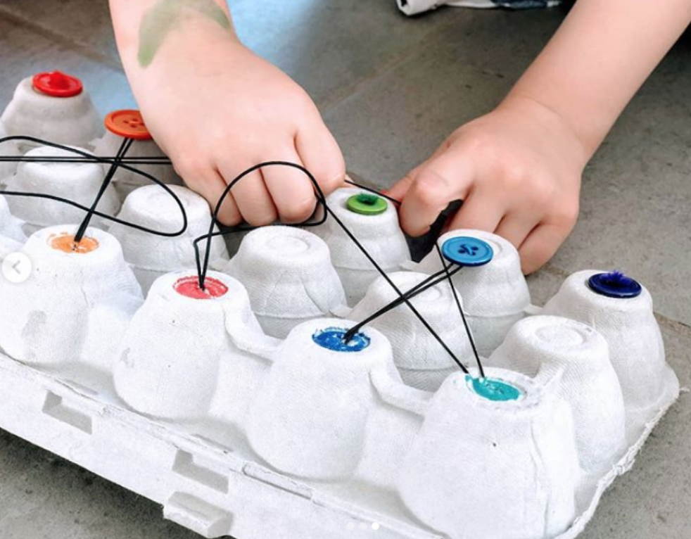 OTPlan uses buttons, egg cartons, and rubberbands to create a fun fine motor activity..