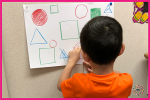 Child coloring pictures on a textured, vertical surface provides increased core strength, endurance, bilateral coordination, midline crossing, and fine motor skills.