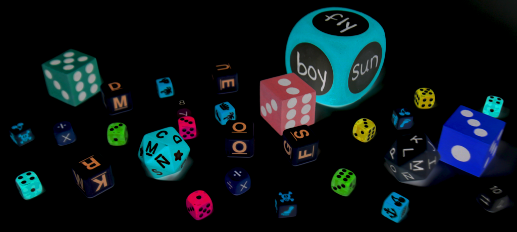 Inverted image of a collection of dice, all shapes, colors, and sizes offering abundant skill building