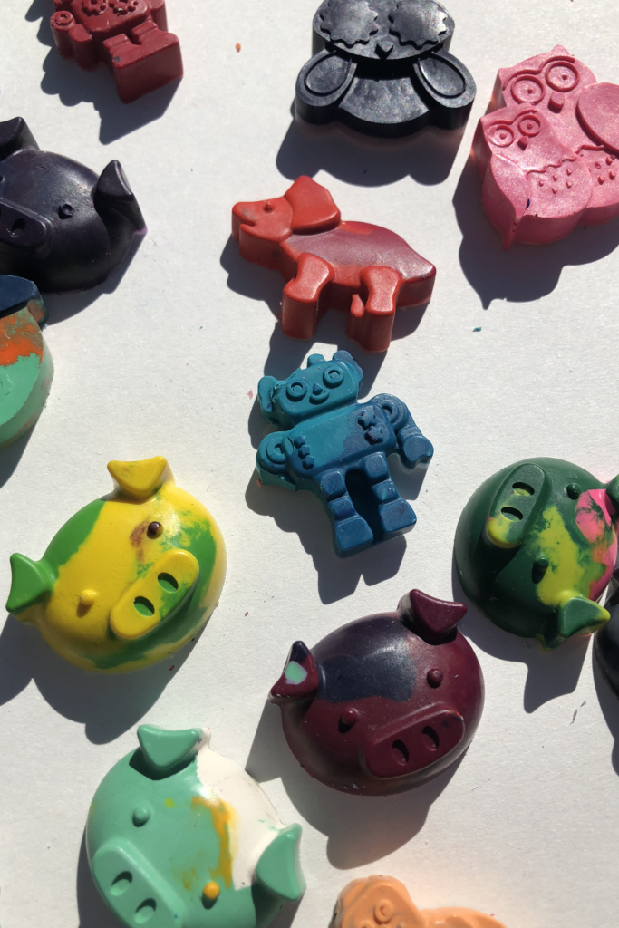 Crayons melted into sure shapes of dinosaurs, pigs, owls, robots